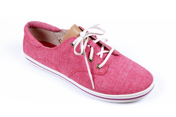 Red sneakers isolated on a white background.