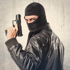 Robber shooting with a pistol