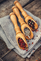 peppercorn in wooden spoons