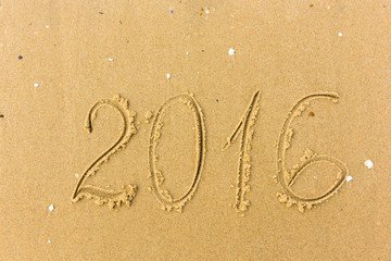 2016 Year written on the beach sand