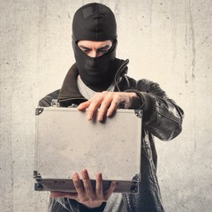Robber holding a briefcase