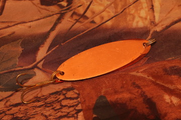 spinners lure on the camouflage background