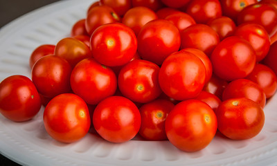 Fresh cherry tomatoes on a white plate
