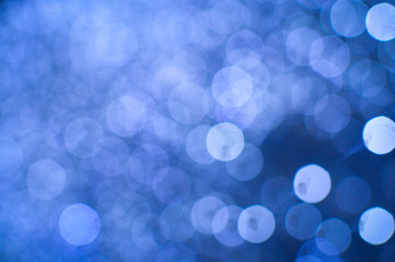 Bokeh illustration with big glowing round light spots on background copy space