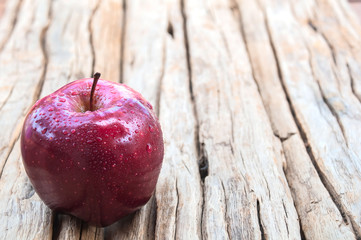 An apple on wooden background