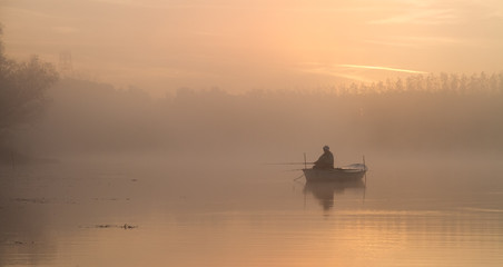 Woman angling in early morning