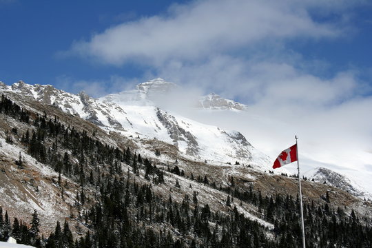 Canadian Rocky Mountains With Flag