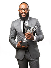 business black man holding a trophy