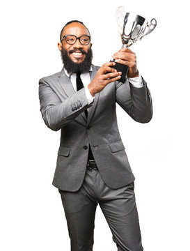 business black man holding a trophy