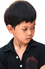 Portrait of young boy looking for something at his left side over white background