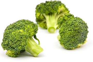 Isolated broccoli over white background, focus at the nearest one