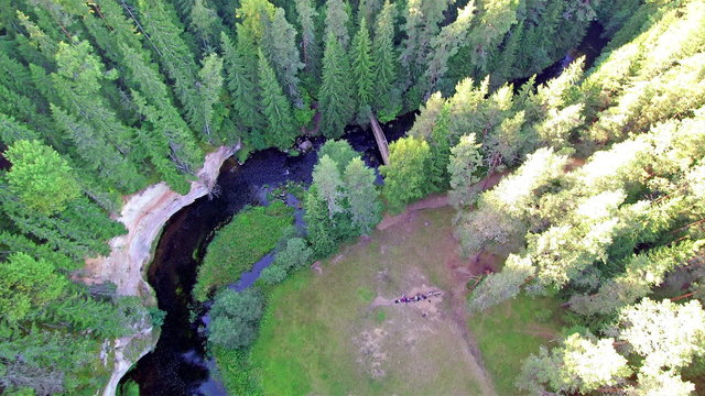The Ahja river in the middle of the green forest in Taevaskoda Estonia. The green forest taht surrounds the river can be seen on the sky view