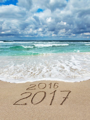 Fototapeta na wymiar New Year 2016 - 2017 on ocean beach calendar cover