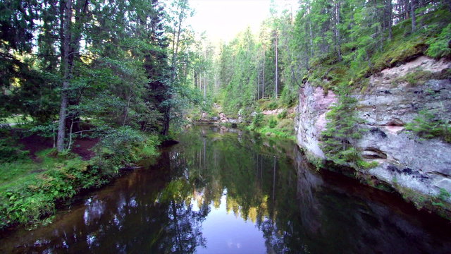 The Ajha river in the small village in Taevaskoda Estonia. The fresh water and the reflection of the trees from the forest