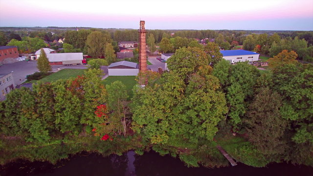 The view of the Rapina paper mill in Estonia. The river on the side of the mill and the trees around it as well