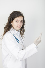 Female doctor putting latex gloves.