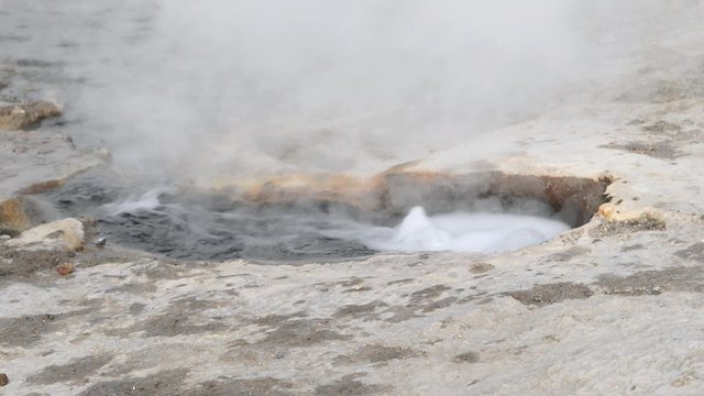 Bubbling geyser at the El Tatio Geyser valley in San Pedro de Atacama, Chile. El Tatio geysers located at 4320 meters above sea level are one of the major tourist attraction in Chile.