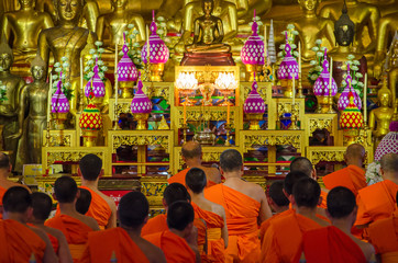 Buddhist Monks in meditation in a temple (Bangkok Thailand)