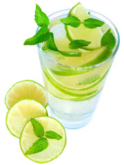 Fruit lemonade with lime and ice cubes and leaf mint