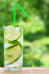 Cocktail mojito with lime and ice cubes