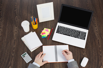 Office workplace with office supplies and laptop