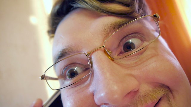 Happy Crazy eye businessman in glasses