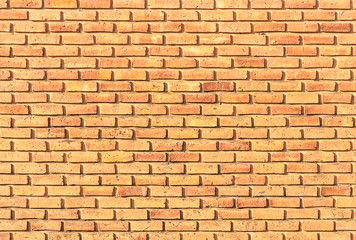 Obraz premium Orange brick wall texture for background use