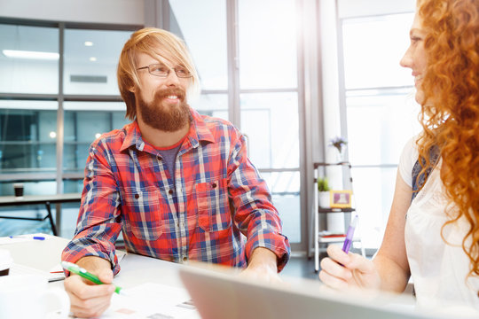 Two co-workers working together