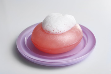 Soap with foam isolated on white