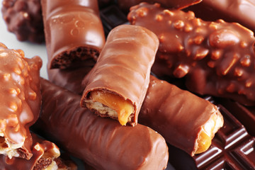 Mix of chocolate bars on table, close-up