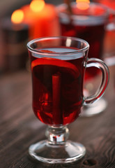 Mulled wine on wooden table, close-up