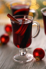 Mulled wine on wooden table, close-up