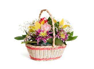 a beautiful bouquet of flowers in a wicker basket isolated on white background