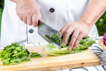 green lettuce on wooden board