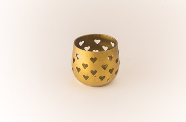 Golden candle holder. Hearths shapes.