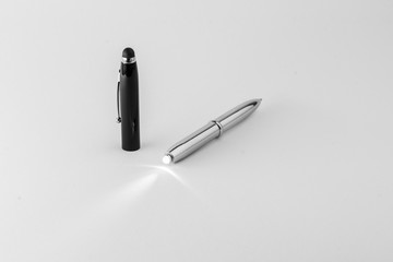 Modern silver pen with torch light.