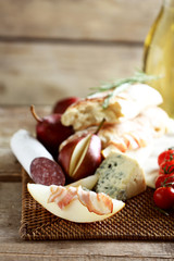 Still life with various types of Italian food and wine