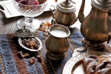 Antique tea-set with Turkish delight and baking on table close-up