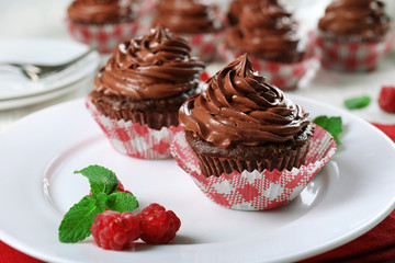 Chocolate cupcakes on plate closeup