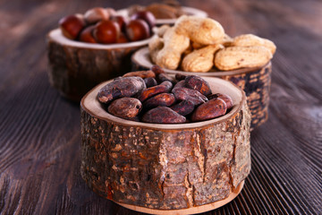 Assortment of tasty nuts on wooden background