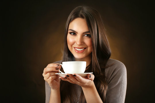 Portrait of pretty woman with cup of coffee
