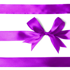 Shiny purple satin ribbon on white background