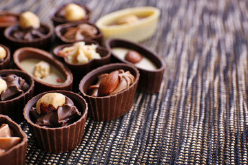 Chocolate sweets on fabric background