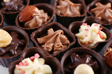 Delicious chocolate candies background, close up