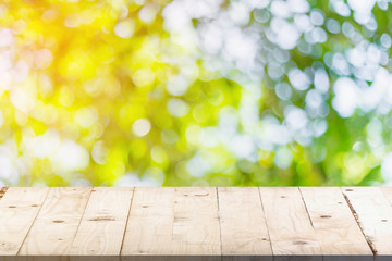 green bokeh in garden and table with space