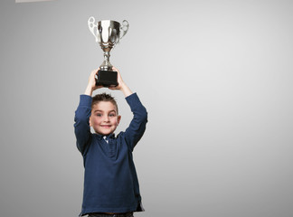 little kid with a trophy