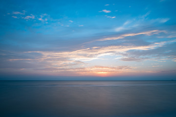 Fototapeta na wymiar Colorful of sunrise on the ocean beach
