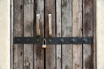 Rustic old plank door with lock