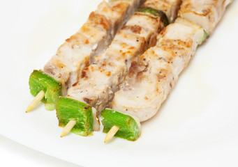 chicken skewers on white background