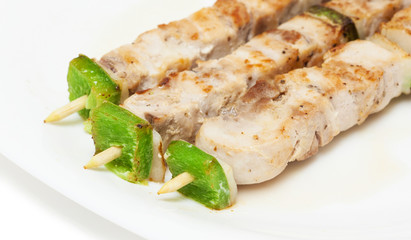 chicken skewers on a plate